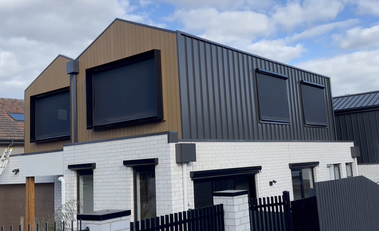 Wire guided blinds installed across a modern multi-storey facade