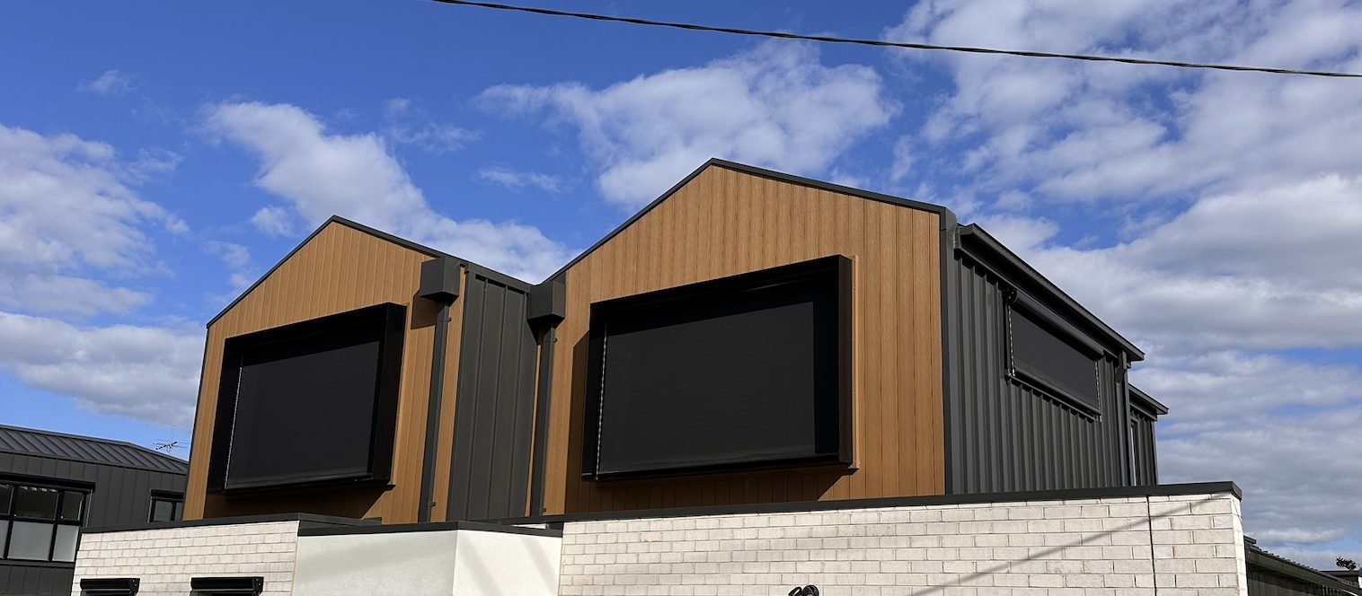 Wire guided blinds installed on a modern exterior