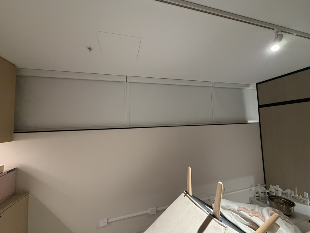 Long interior window with white Ziptrak Interior blinds lowered